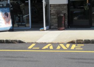 Curb ramp with steep side slopes